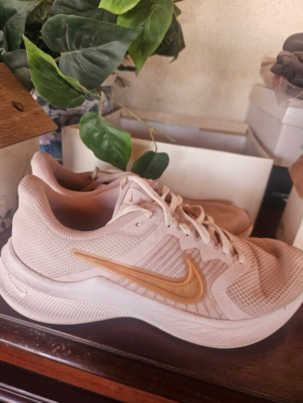 Nike Women's Pale Pink Running Sneakers with Gold Swoosh